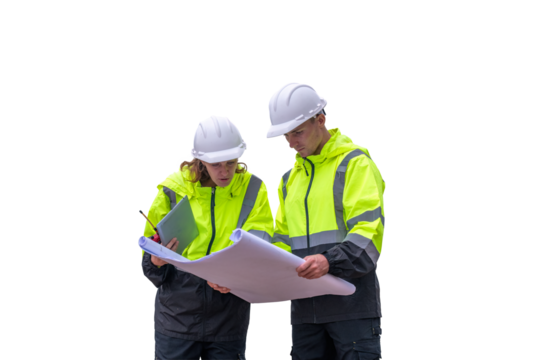 Engineers wearing safety gear, including hard hats examining survey a tablet standing industrial facility gas task or oil refinery engaged in a job requires high safety standards concept
