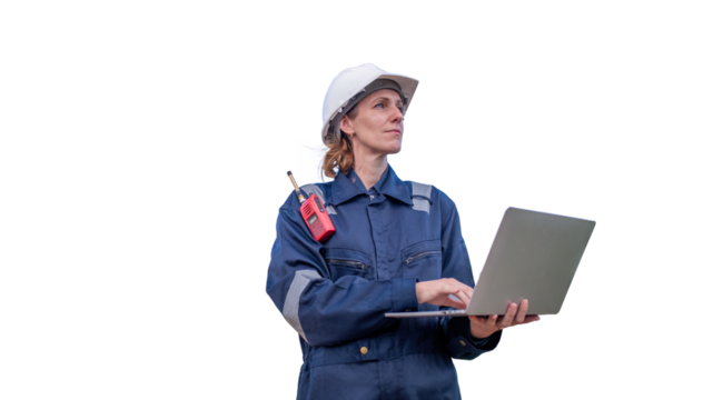 Engineers wearing safety gear, including hard hats examining survey a tablet standing industrial facility gas task or oil refinery engaged in a job requires high safety standards concept