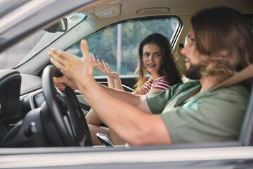 Couple arguing in a car, showcasing tension between driver and passenger The interior reflect emotional frustration