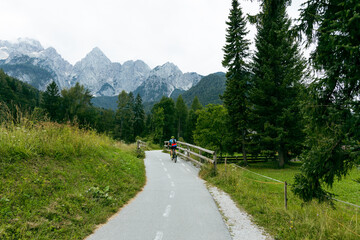 cyclist rides along a mountain road