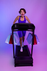 Photo of excited sporty girl using running machine hurry for black friday sport sales isolated neon color background
