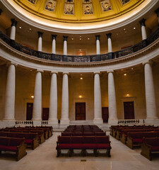 Obraz premium The Capitol building's interior in Washington, DC, featuring elegant columns and intricate design elements. 