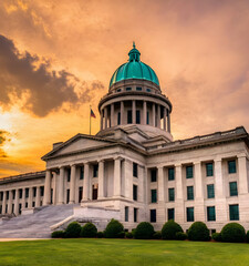 Obraz premium The New Hampshire state capitol building, distinguished by its golden dome and elegant design, set in a scenic landscape. 