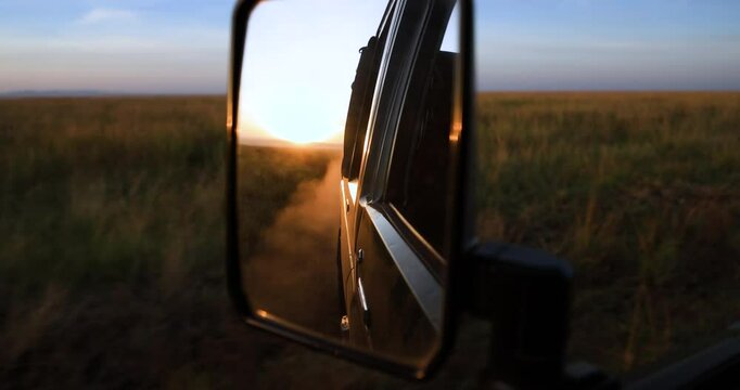 A 4x4 drives through the savannah in Kenya