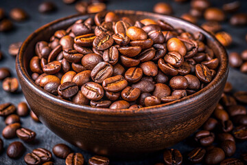 Fototapeta premium Close-up of roasted coffee beans in a dark bowl