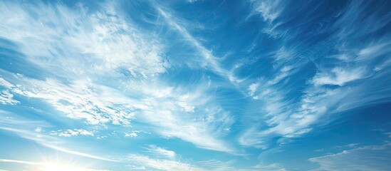 Beautiful blue sky with thin white clouds perfect for a copy space image