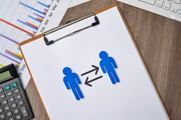 Two blue figures on a clipboard, facing each other with arrows pointing in both directions. This...