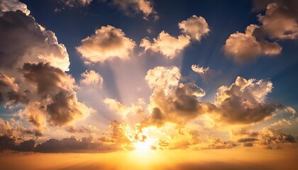 Obraz premium golden sunrise sky with cumulus clouds and sun