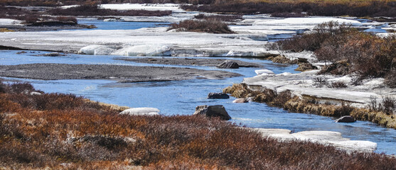 Early spring at creek on Dempster Highways, Yukon, Canada