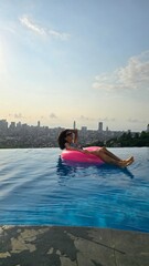 woman relaxing in a swimming pool