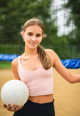 teen play beach volleyball in summer season