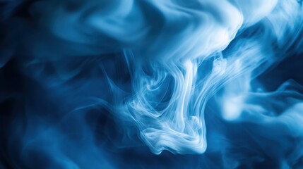 Fototapeta premium Ethereal Blue Smoke Swirls on Dark Background for Artistic Effect