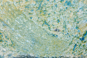 Colorful old stone background with dark cracks, great for your design and texture background