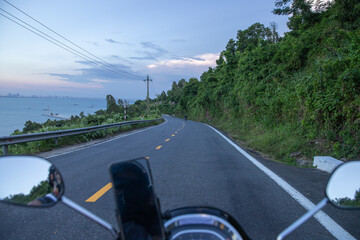 driving a motorbike on the road in the mountains
