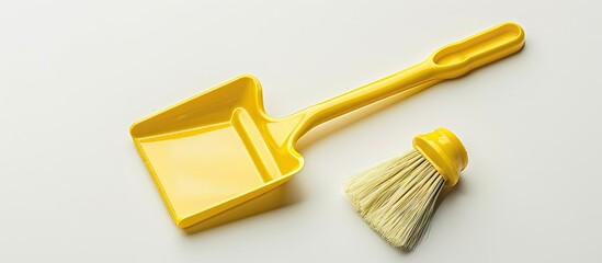Plastic mini dustpan and brush versatile and isolated on a white background perfect for many uses with space for adding images. Creative banner. Copyspace image