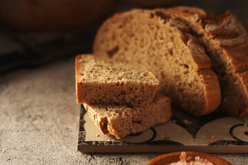 A loaf of rye bread in low key