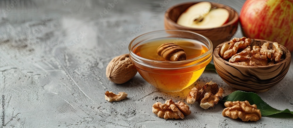 Poster Sweet honey bowls with walnuts and apples displayed on a grey backdrop with copy space image
