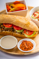 sandwich shawarma chicken in a baguette middle eastern food salad and pickles  israeli food restaurant menu day time