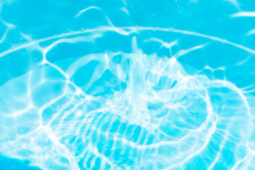 Blue water with ripples on the surface. Defocus blurred transparent blue colored clear calm water...