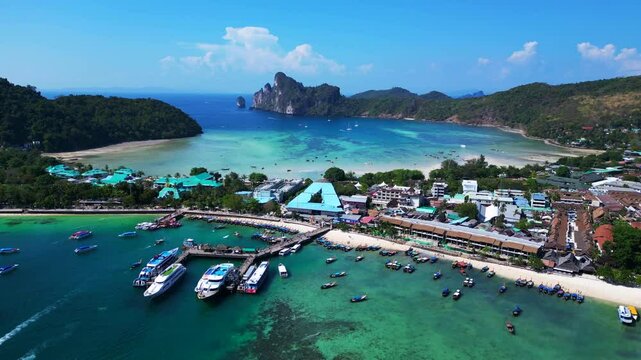 Phi phi island tonsai pier with boats docked Lovely aerial view flight drone