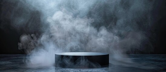 Cylindrical stage with a dark background and smoke for presentations offers ample copy space image