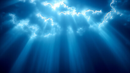 Fototapeta premium Blue sky background with rays of light shining down, creating an atmosphere that evokes calmness and hope