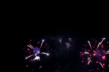Fireworks on the dark sky background. Colorful fireworks from Loto Quebec in Quebec city, Canada. Abstract colored firework background with free space for text. fireworks light up the night sky