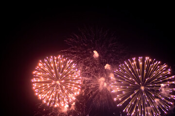 Fireworks on the dark sky background. Colorful fireworks from Loto Quebec in Quebec city, Canada. Abstract colored firework background with free space for text. fireworks light up the night sky