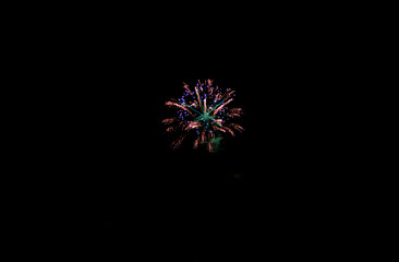 Fireworks on the dark sky background. Colorful fireworks from Loto Quebec in Quebec city, Canada. Abstract colored firework background with free space for text. fireworks light up the night sky