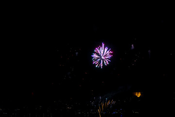 Fireworks on the dark sky background. Colorful fireworks from Loto Quebec in Quebec city, Canada. Abstract colored firework background with free space for text. fireworks light up the night sky