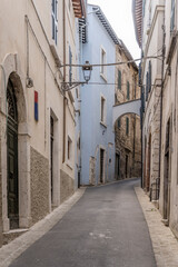 Fototapeta premium narrow uphill street at medieval hilltop little town, Amelia, Italy