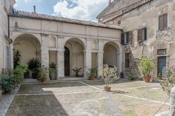arched loggia at medieval hilltop little town, Amelia, Italy