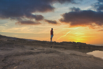 man watching the sunset in the delta mallorca