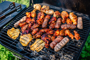 grilled meat over the coals on barbecue