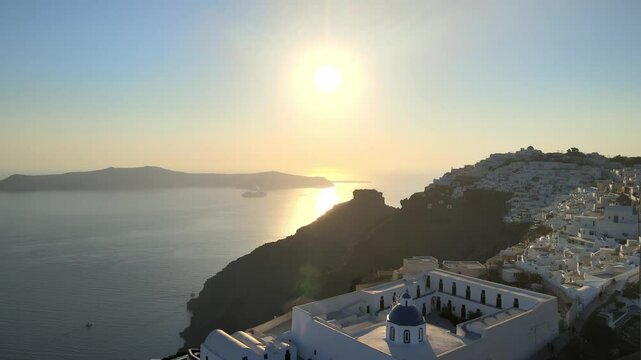 Aerial view at sunset of the volcano coasts of Santorini island in Greece