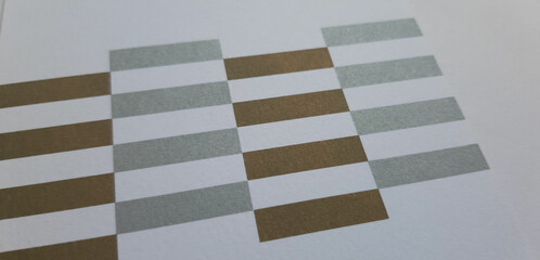 abstract white paper texture with geometric elements and stripes printed in dark gold and silver, close-up textured background, beautiful wallpaper, cover or banner with space for design