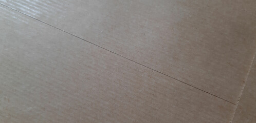 abstract craft paper texture, brown paper background close-up surface with stripes, joints and space for design