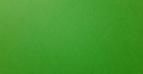 abstract bright green color paper texture, close-up clear textured surface, beautiful clean background and wallpaper with space for design