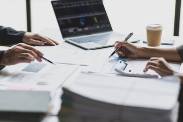 Coworkers are discussing company financial planning during a budget meeting. Business adviser meeting to discuss the situation on the financial report, accounting, investment.