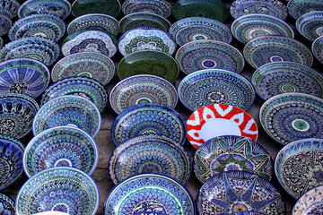 Decorative ceramic plates with traditional uzbekistan ornament on street market of Bukhara. Uzbekistan, Central Asia, Silk Road