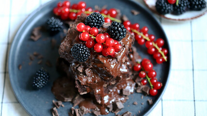 Brownies with berries and liquid chocolate