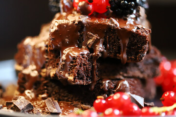 Brownies with berries and liquid chocolate