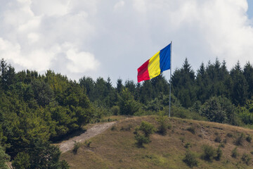 Romanian flag waving in Apuseni mountains 