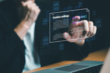 hand using computer laptop while choose to accept internet cookies policy or reject. Customer data privacy concept that allow web browser to collect user data to resell or use for marketing purpose.