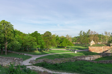 Fototapeta premium A park with a path that leads to a building