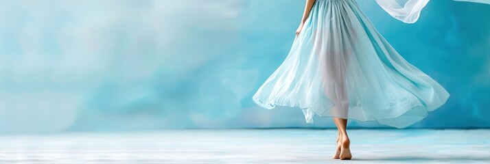 Elegant ballerina in a flowing blue dress dances gracefully on her toes, showcasing poise and artistry against a pastel background.