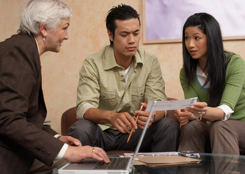 Couple Meeting With Financial Advisor