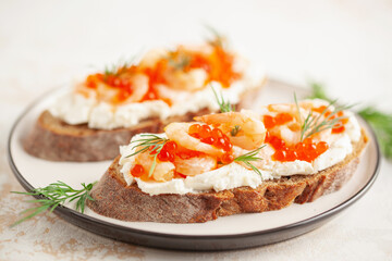 Toast skagen - shrimps and red caviar on bread. Classic swedish sandwich.