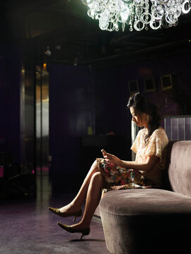 Woman Sitting in Club