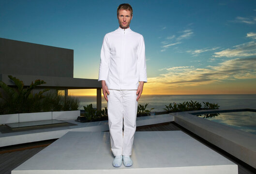Portrait of Man Standing on Patio at Sunset